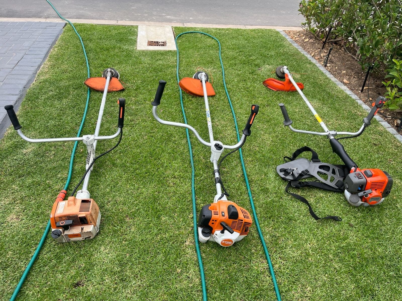 2Green's STIHL petrol brushcutters laid out on a manicured lawn at a Val de Vie estate in Paarl